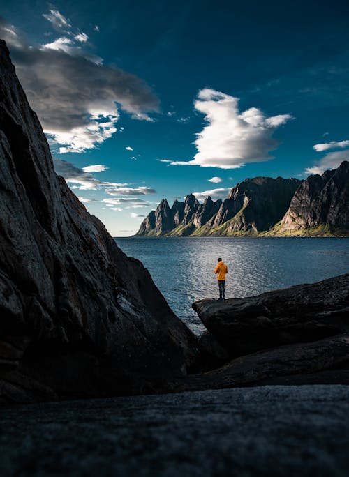 A Person Looking at Oksehornan in Tungeneset