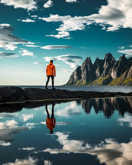 A Person Looking at Oksehornan in Tungeneset