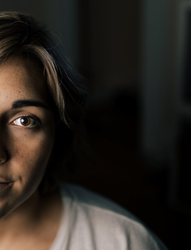 Anonymous Woman In Dark Room