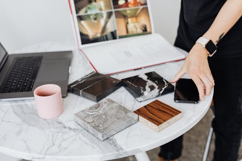 Close-up of Person Choosing Table Surface with Samples