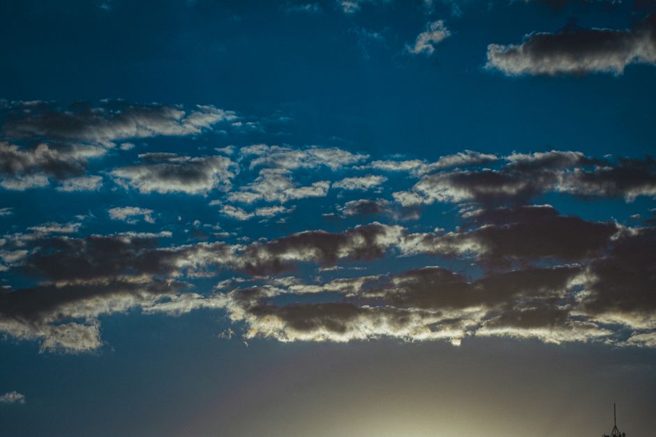 From below of bright blue sky with colorful stratocumulus clouds in sunny day