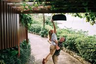 Happy Couple Having Fun in Tropical Garden