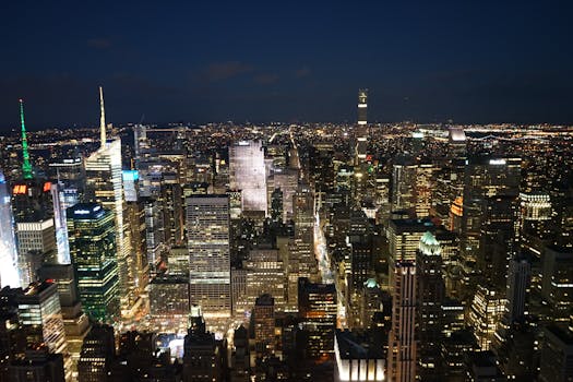 A breathtaking aerial view of New York City's illuminated skyline at night.