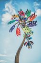 Multicolored vane under blue cloudy sky in daylight