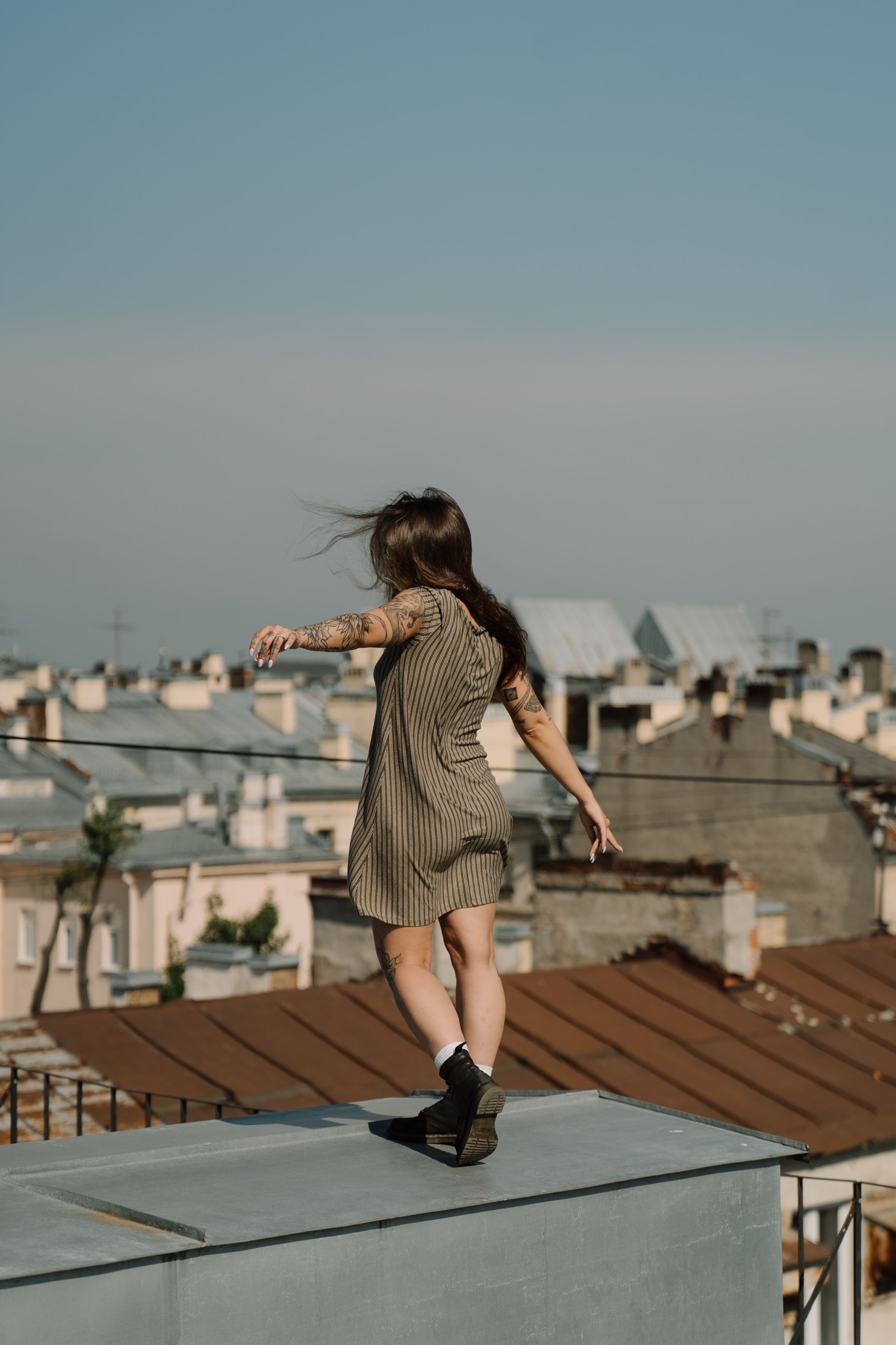 Woman in Gray Dress Standing on Gray Concrete Floor · Free Stock Photo