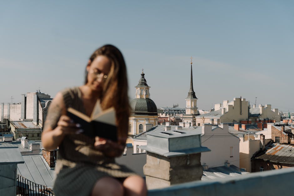 a resident enjoying a building's rooftop deck with a city skyline background - studio apartments river north a resident enjoying a building's rooftop deck with a city skyline background - studio apartments river north
