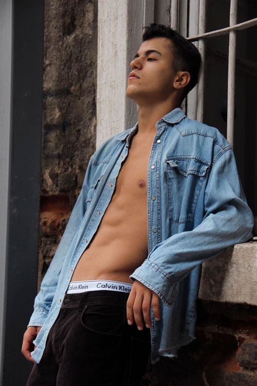 Person in Denim Jacket Leaning on a Window · Free Stock Photo