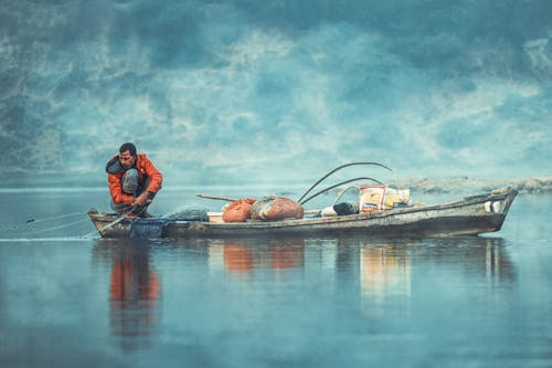 Free Man on the Fishing Boat Stock Photo