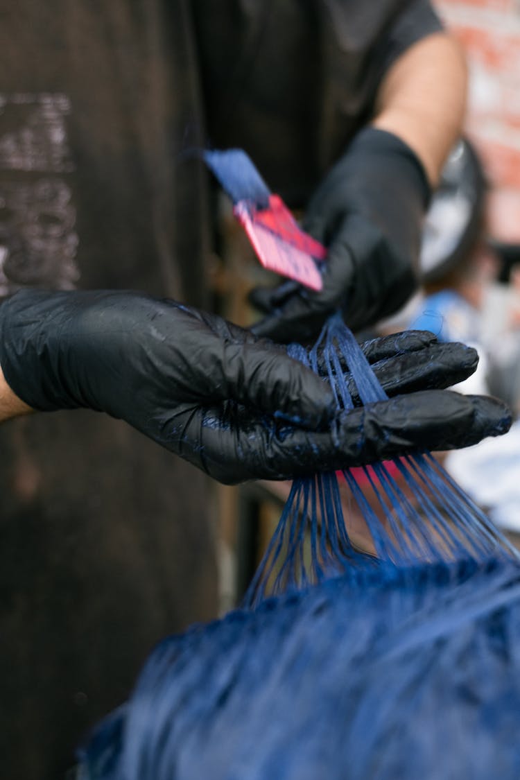 Hairdresser Wearing Gloves Dyeing Hair Blue