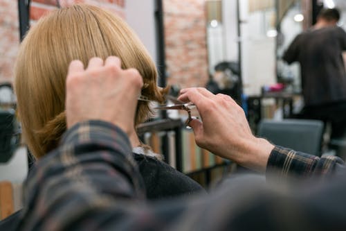 Free Back View of a Woman at Hairdresser Stock Photo