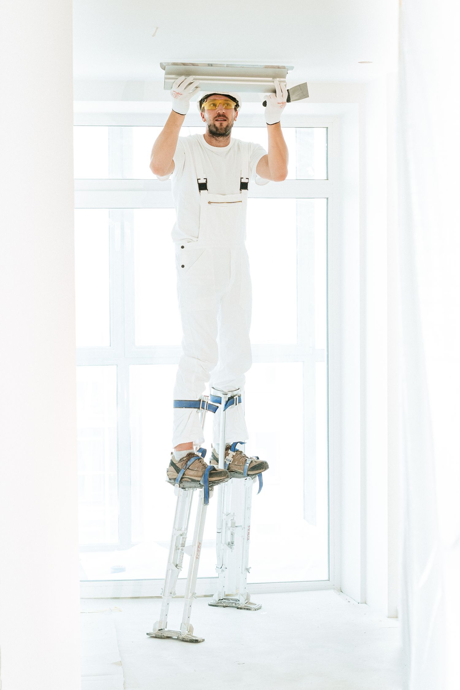 Professional working on an interior wall and ceiling