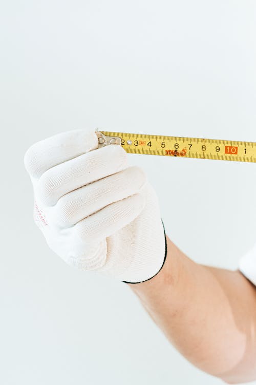 A Person Holding a Tape Measure