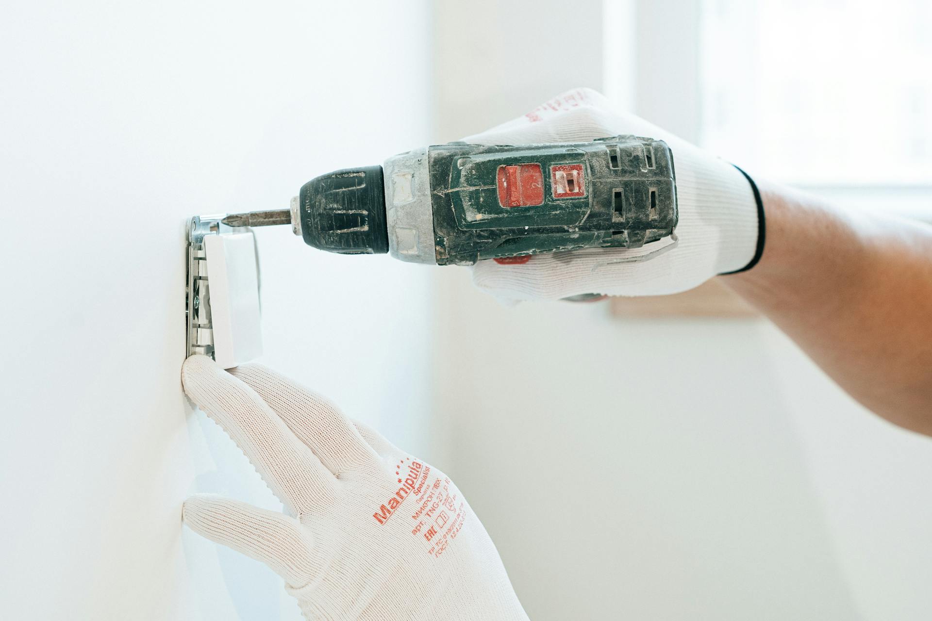 A Man using Power Tool