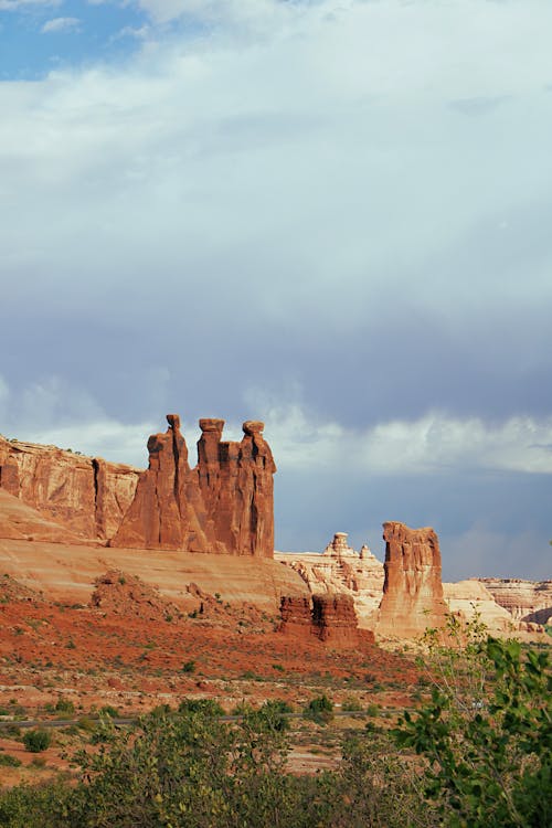 Brown Rock Formations Under the Cloudy Sky 