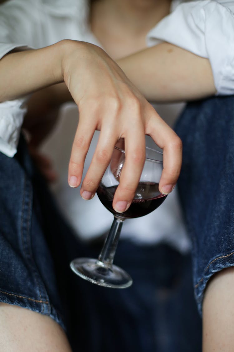 Person Holding Clear Wine Glass