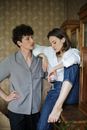 Man in Gray Button Up Shirt and Woman in White Dress Shirt