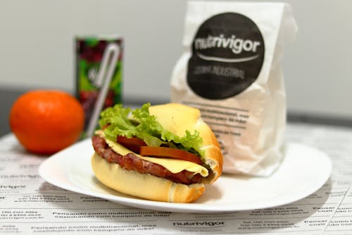 Burger With Lettuce and Tomato on White Ceramic Plate