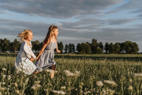 Free A Two Young Girl Running Together Stock Photo