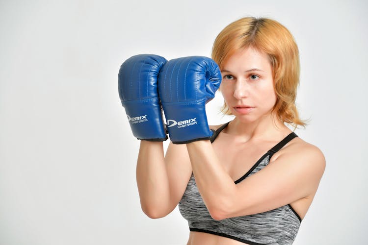 Young Female Boxer In Defense Stance