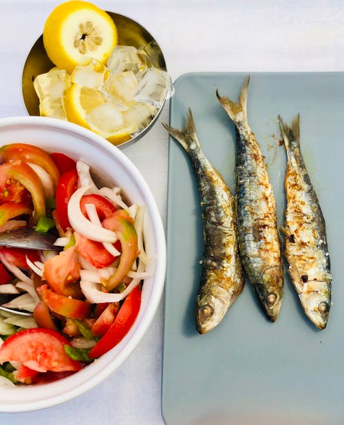 Grilled Fish on White Ceramic Plate