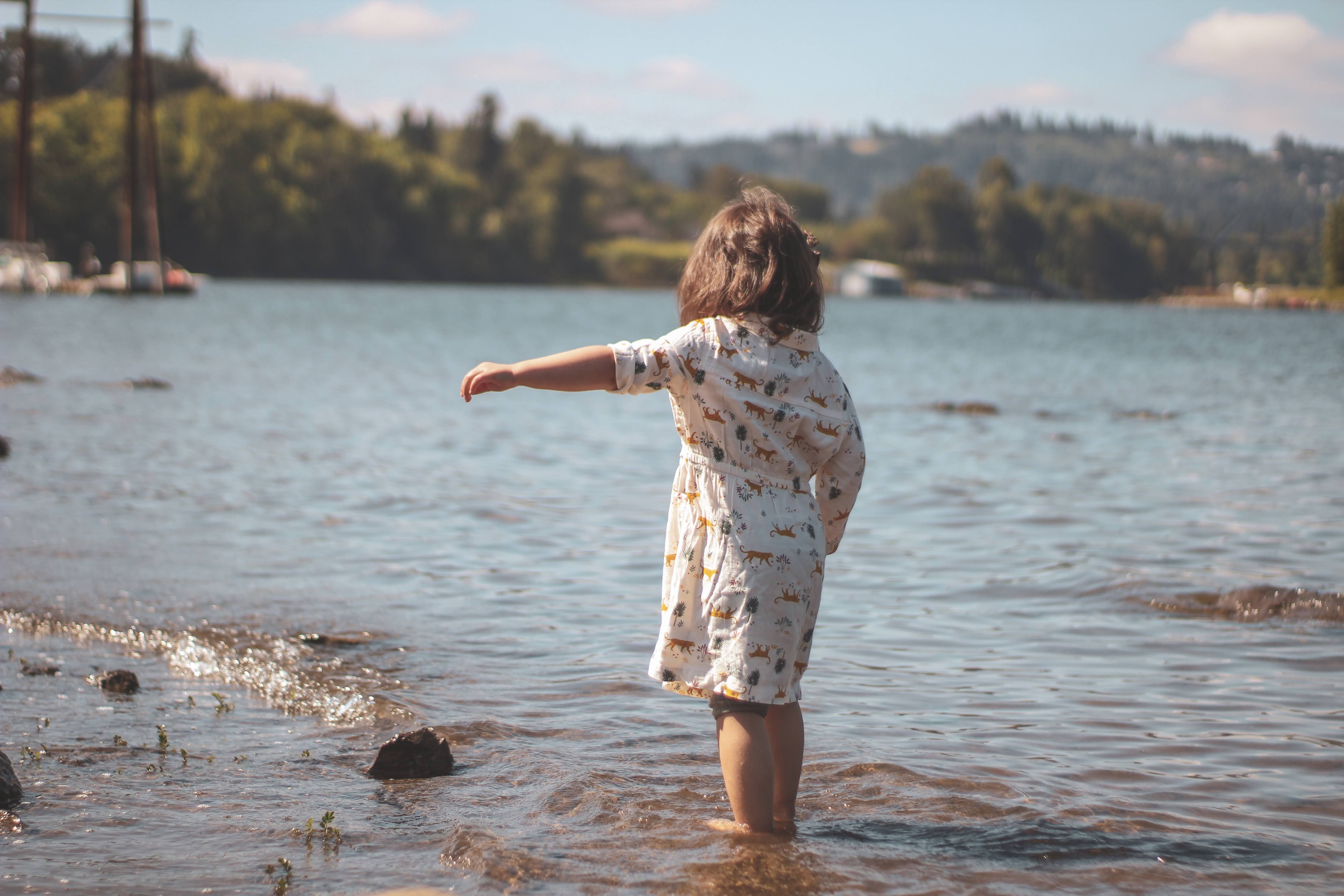 Girl in White Dress Standing on Water · Free Stock Photo