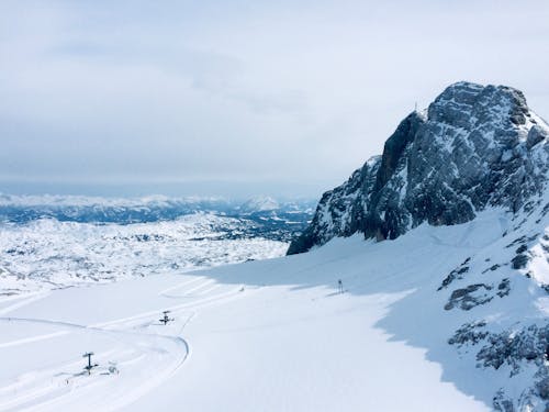 Mountain Peak and Ski Lift in Snow