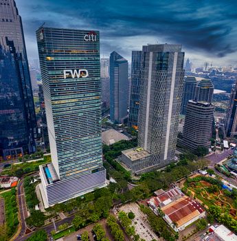High-rise buildings and modern architecture in Jakarta captured from above with a dramatic sky. - Fotografer Sidoarjo