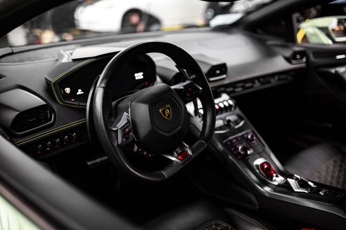 Free Close-up view of a luxurious Lamborghini car interior, showcasing the modern steering wheel and dashboard design. Stock Photo