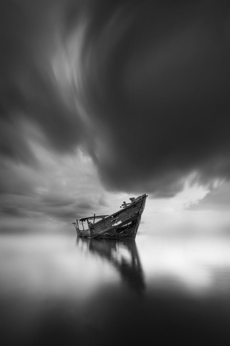 Dramatic Sky Over A Shipwreck Abandoned On A Lake