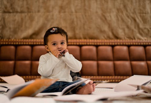 Pensive child sitting in room