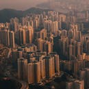 Modern megapolis with skyscrapers near sea at sundown