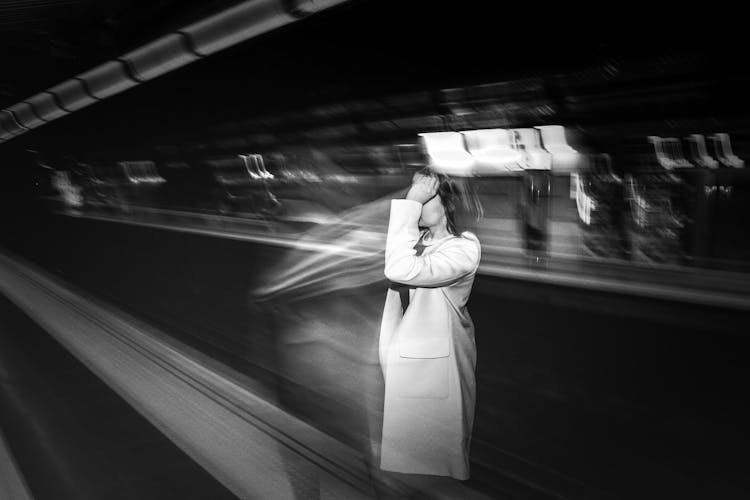 Faceless Woman Waiting For Metro Cabin In Subway