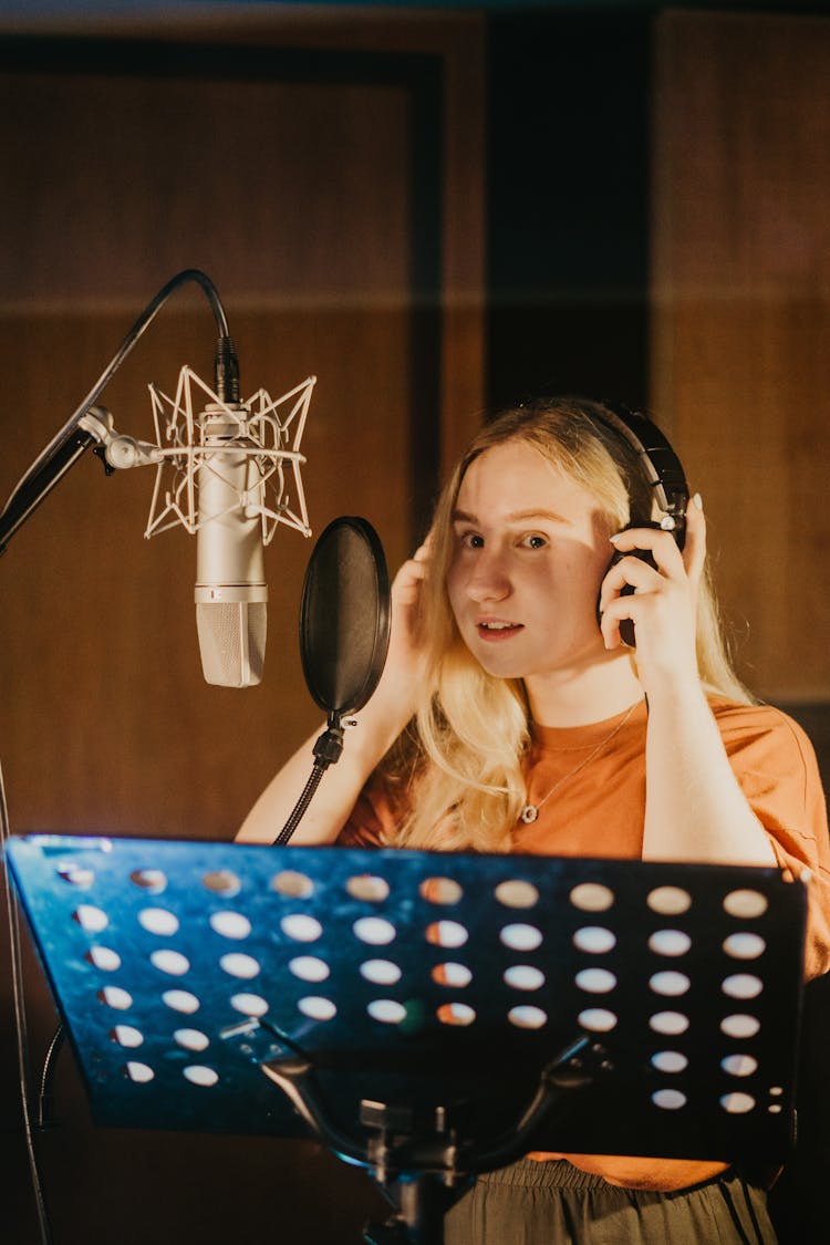 A Woman Inside A Recording Studio