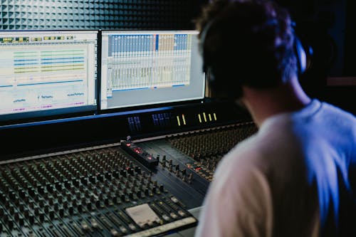 A Man in Control of the  Audio Mixer