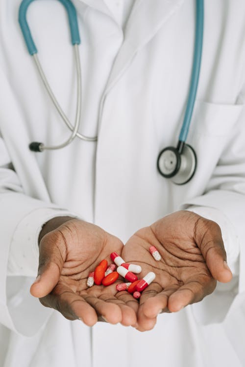 Free Medicines on a Doctor's Hands Stock Photo