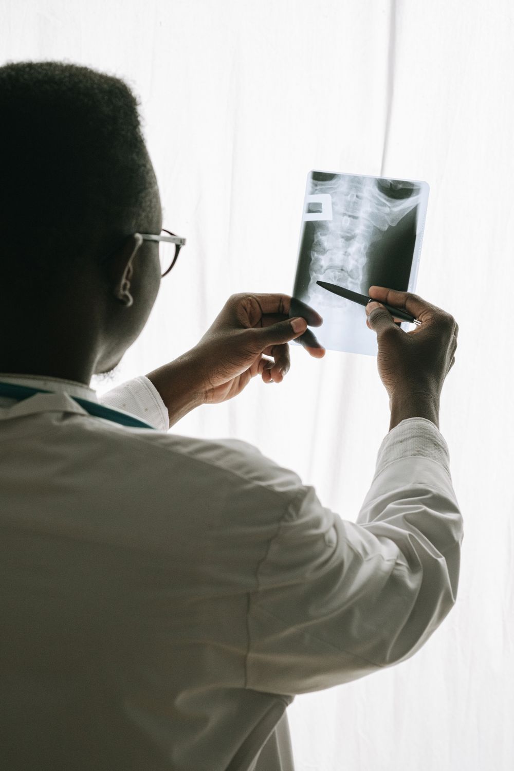 Doctor reviewing an X-ray film