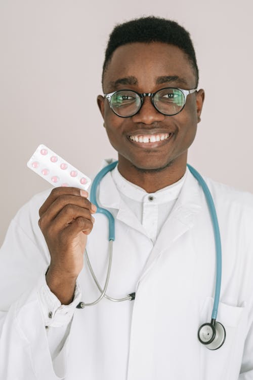 Free Man Holding a Medicine Stock Photo
