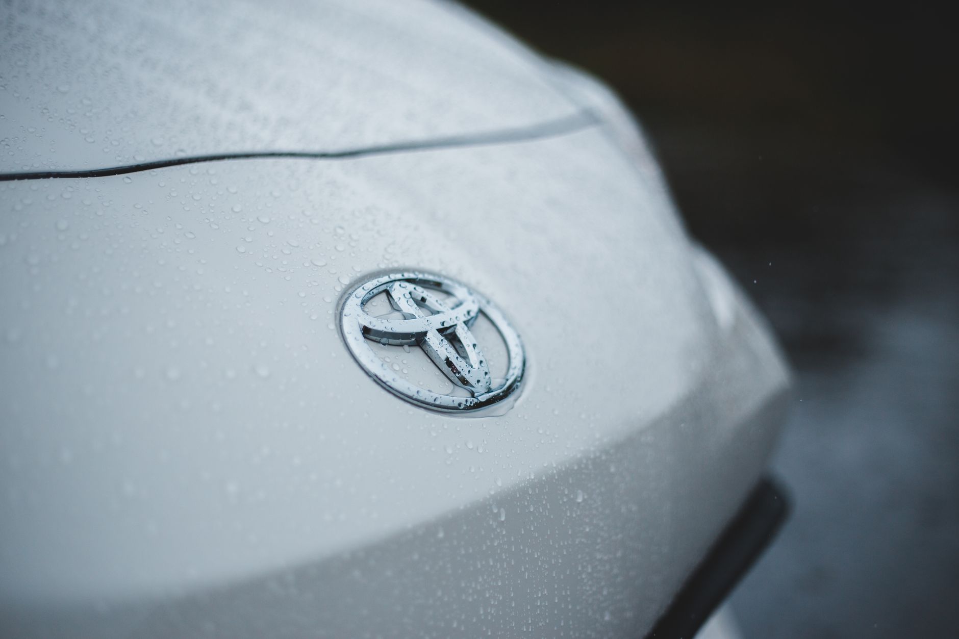 Shiny car with drops of rain