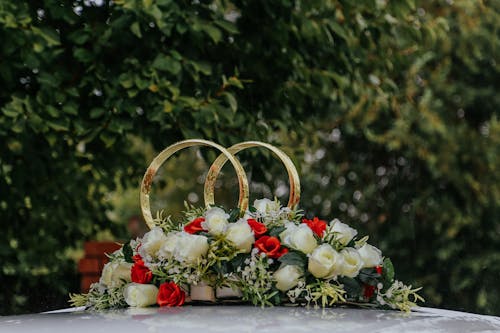 Elegant wedding decorations on white car
