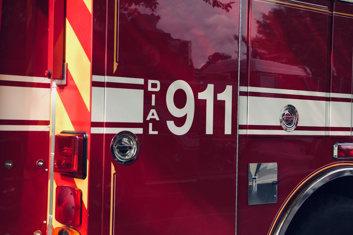 Free Emergency Number on Firetruck Stock Photo