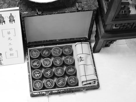 High angle view of a traditional Chinese chess set in a decorative case, capturing cultural essence.