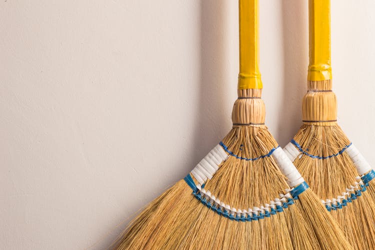 Close-Up Shot Of Brooms 