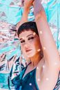 Attractive woman with glitter on body