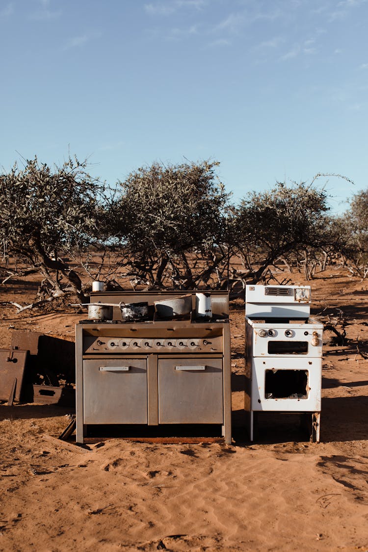 Old Discarded Cabinet With Stove In Desert