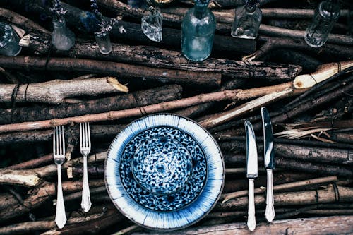 Tableware with decorative elements on wooden surface