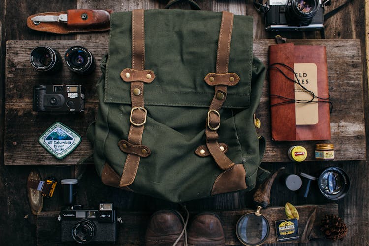 Set Of Different Items For Exploration On Desk With Cameras