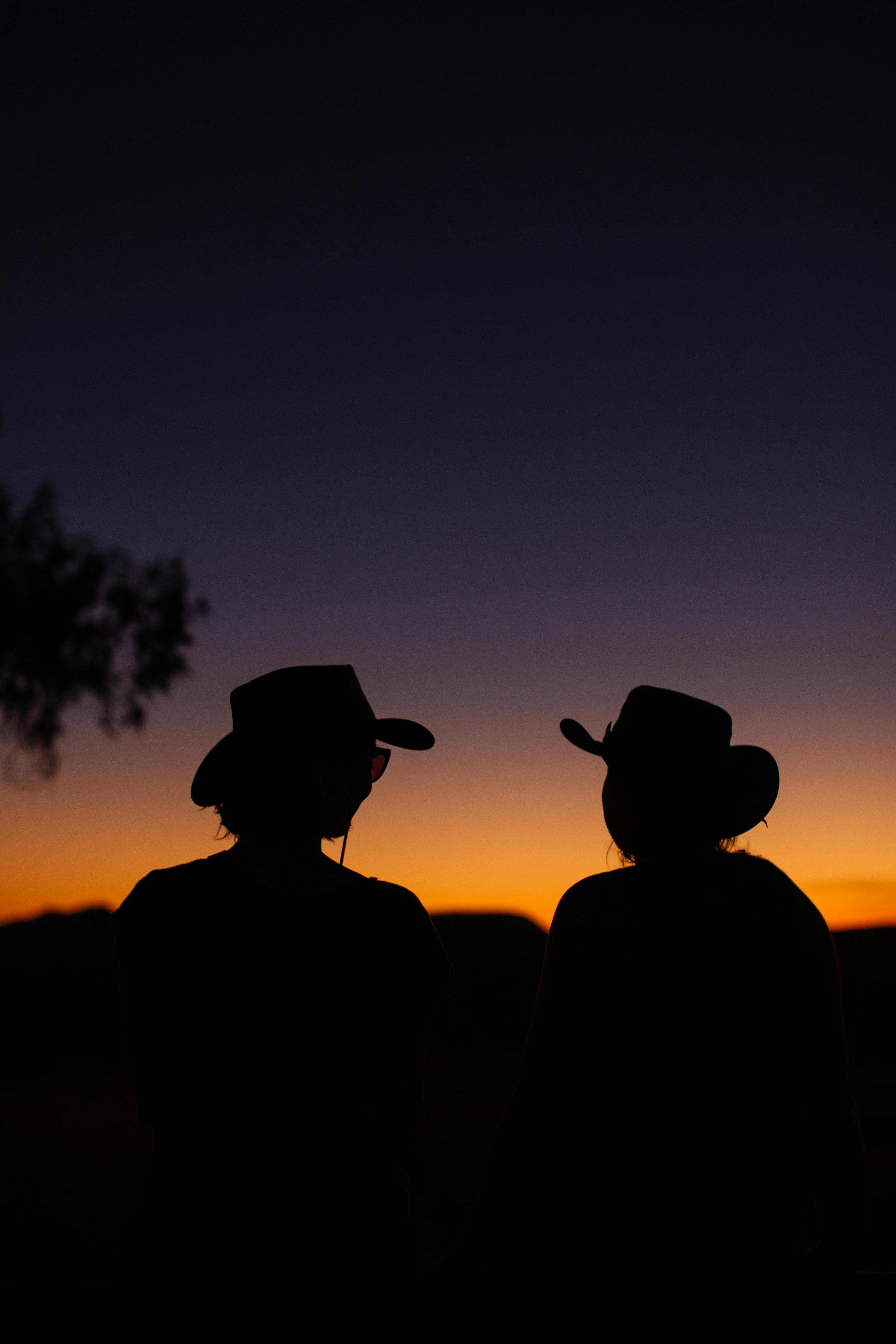 unrecognizable women in nature in sunset