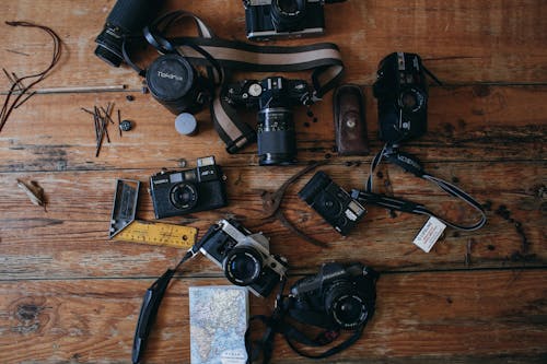 Free Retro cameras on wooden surface Stock Photo