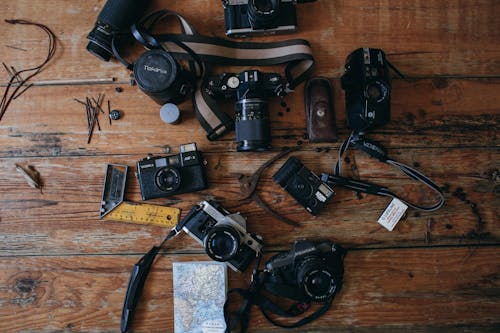 Retro cameras on wooden surface