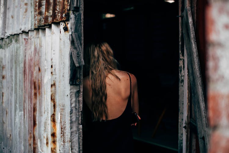 Woman With Long Hair In Shabby Barn